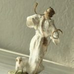 one of the shepherd is calling melodically and holding his horn beside his sheep