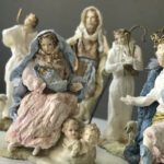 Maria is sitting on the rock with Jesus