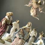 A high view of the nativity scene while Gloria angel is protecting Jesus